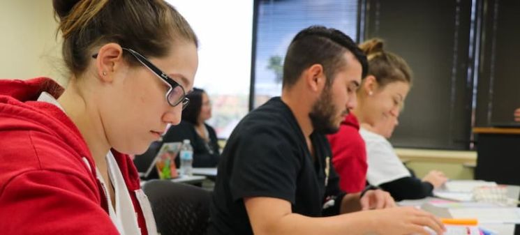 Nursing students at Jersey College practice techniques in the simulation lab.